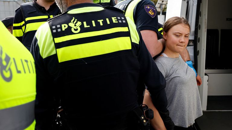 Swedish climate campaigner Greta Thunberg is detained by police, on the day climate activists try to block the A12 highway to ensure that the Dutch government stops subsidies for fossil fuels, in The Hague, Netherlands, April 6, 2024. REUTERS/Piroschka van de Wouw