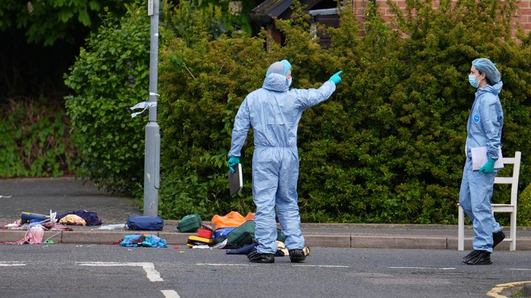 Forensic investigators in Laing Close in Hainault/ Pic: PA