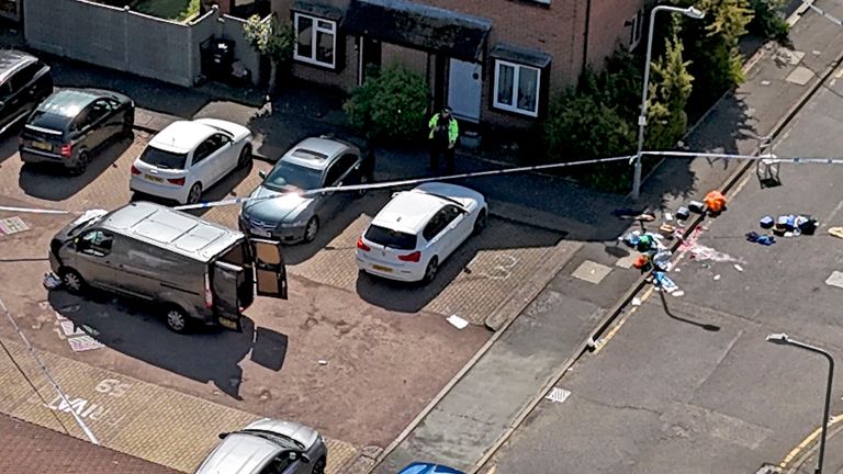 Police taped off a van in a street in Hainault. Pic: PA