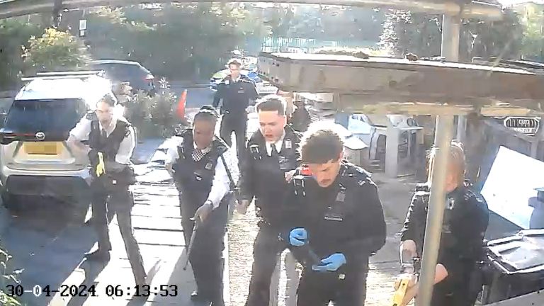 Pic: PA
RETRANSMITTED AMENDING BYLINE NUMBERPLATE AND FACES OF ARMED POLICE OFFICERS PIXELATED BY PA PICTURE DESK Handout footage from a doorbell camera of police officers after tasering and detaining a sword-wielding man in Hainault, north east London, after a 14-year-old boy died after being stabbed following an attack on members of the public and two police officers. Picture date: Tuesday April 30, 2024.