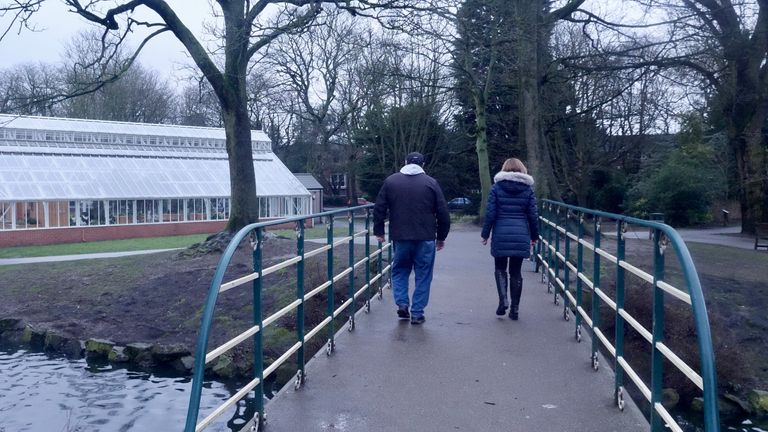 Mustafa walks with Paste BN' Becky Johnson in the park where he sleeps