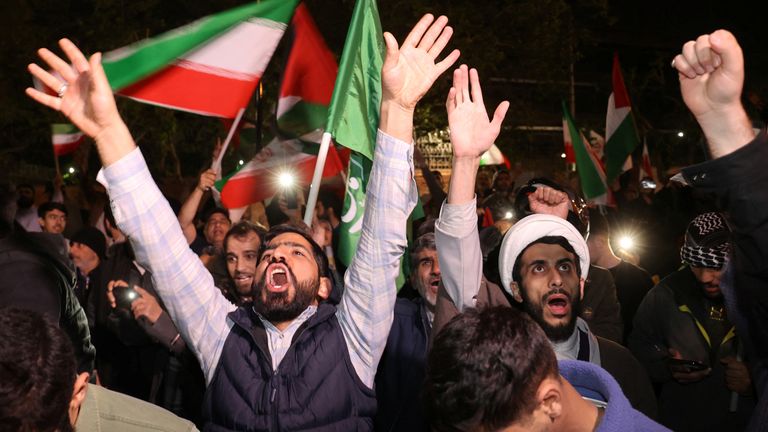 Iranian demonstrators react after the IRGC attack on Israel, during an anti-Israeli gathering in front of the British Embassy in Tehran, Iran.

Pic: Majid Asgaripour/WANA (West Asia News Agency) via Reuters