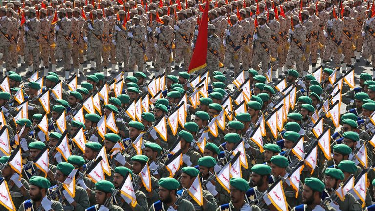 Iran&#39;s paramilitary Revolutionary Guard troops march during a military parade commemorating the anniversary of the start of the 1980-88 Iraq-Iran war, in front of the shrine of the late revolutionary founder Ayatollah Khomeini, just outside Tehran, Iran, Thursday, Sept. 22, 2022. (AP Photo/Vahid Salemi)
