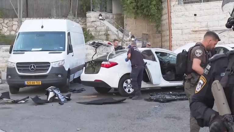Israeli Police said two attackers then exited the car with a sub-machine gun and fled.