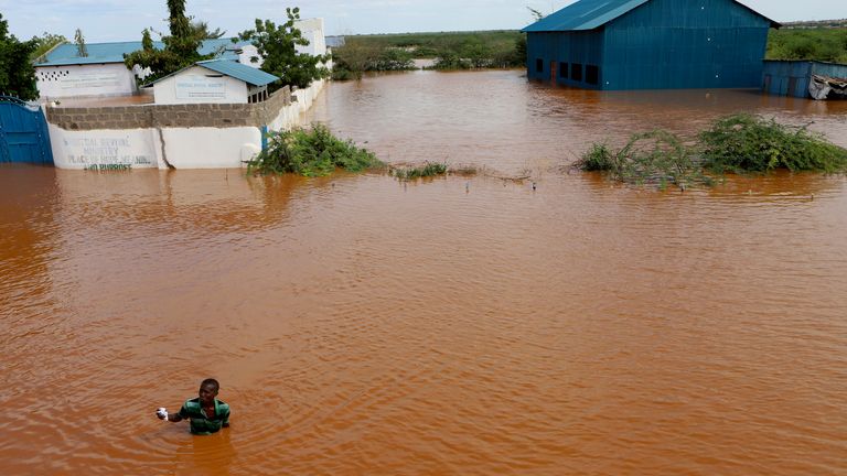 A man swims from a submerged church compound, after the River Tana broke its banks following heavy rains at Mororo, border of Tana River and Garissa counties, North Eastern Kenya.
Pic: AP