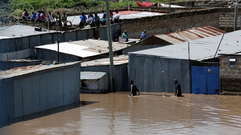People wait for rescue assistance in Machakos County. Pic: Reuters