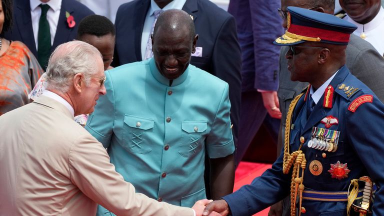 FILE - Kenya's military chief General Francis Ogolla, right, shakes hand with Britain's King Charles III, left, and Kenya's President William Ruto, center, as they attend a military welcome ceremony during Charles' visit at the Mtongwe Naval Base in Mombasa, Kenya, Nov. 2, 2023. Ogolla died in a helicopter crash west of the country, President William Ruto announced Thursday, April 18, 2024, evening and declared three days of national mourning. (AP Photo/Brian Inganga, File)