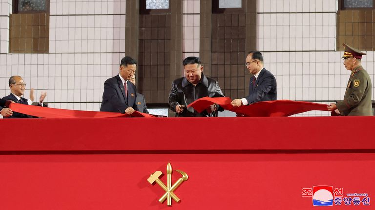 North Korean leader Kim Jong Un cuts the ribbon during a completion ceremony for a residential development area in Hwasong district, North Korea, April 16, 2024, in this picture released by the Korean Central News Agency. KCNA via REUTERS ATTENTION EDITORS - THIS IMAGE WAS PROVIDED BY A THIRD PARTY. REUTERS IS UNABLE TO INDEPENDENTLY VERIFY THIS IMAGE. NO THIRD PARTY SALES. SOUTH KOREA OUT. NO COMMERCIAL OR EDITORIAL SALES IN SOUTH KOREA.