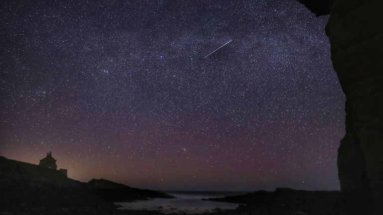 Lyrid meteors fall through the sky at the Bathing House near Howick, Northumberland on 22 April 2020. Pic: PA