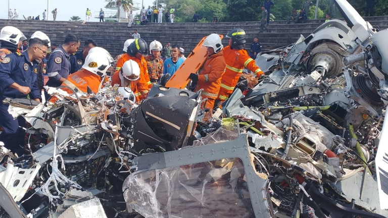 Ten people have died after two helicopters collided in mid-air during a rehearsal for a Royal Malaysian Navy parade. Pic: Perak Fire and Rescue Department.