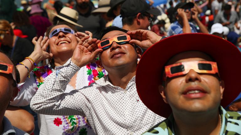 People use special protective glasses to observe a total solar eclipse in Mazatlan, Mexico April 8, 2024. Pic:Reuters/Henry Romero