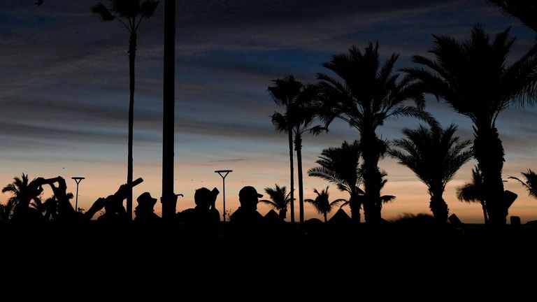 People watch a total solar eclipse as the sky goes dark in Mazatlan, Mexico, Monday, April 8, 2024. Pic: AP Photo/Fernando Llano