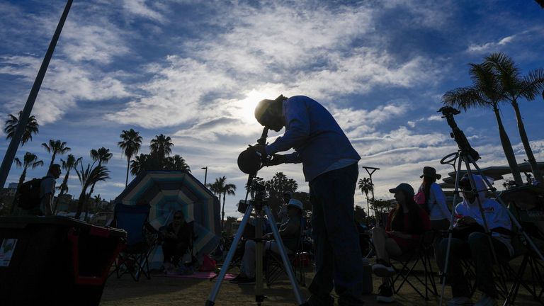 Amateur astronomers prepare to watch a total solar eclipse in Mazatlan, Mexico.
Pic: AP