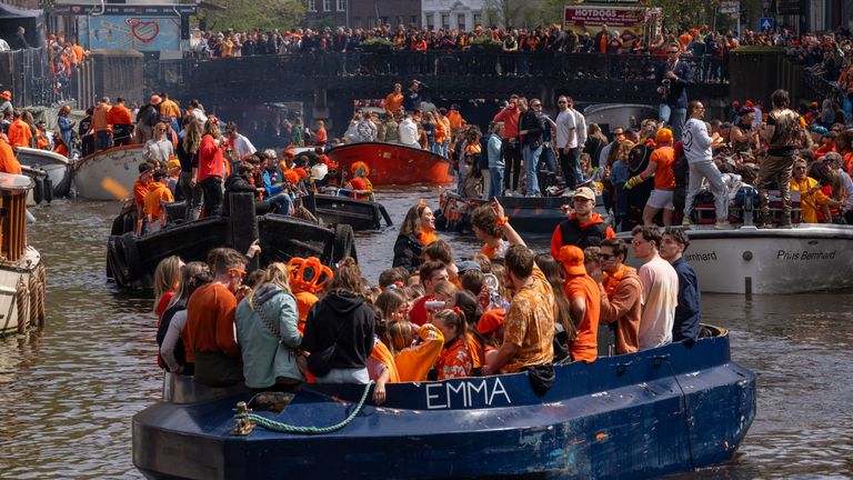 People celebrate King&#39;s Day on the canals of Amsterdam, Netherlands, Saturday, April 27, 2024. (AP Photo/Peter Dejong)
