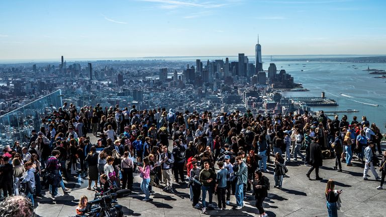 People gather on the observation deck of Edge at Hudson Yards before a partial solar eclipse in New York.
Pic: Reuters