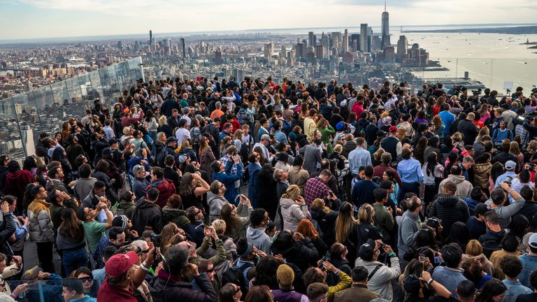 People watch the partial solar eclipse as they gather on the observation deck of Edge at Hudson Yards in New York.
Pic: Reuters