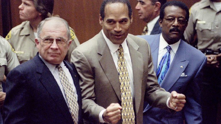 OJ Simpson reacts to the not guilty verdicts in his double murder trial in 1995. Pic: Reuters