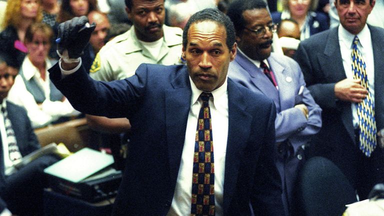 OJ Simpson grasps a marker while wearing the leather gloves prosecutors say he wore the night his ex-wife Nicole Brown Simpson and Ron Goldman were murdered.
Pic: Reuters