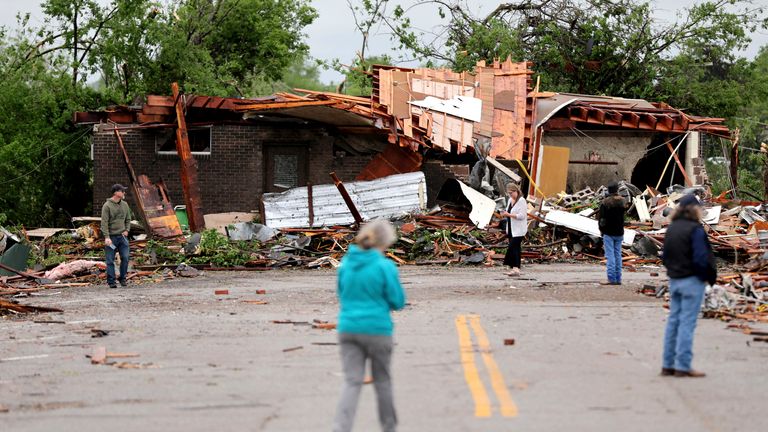 People look at tornado damage in Sulphur, Oklahoma.
Pic: AP