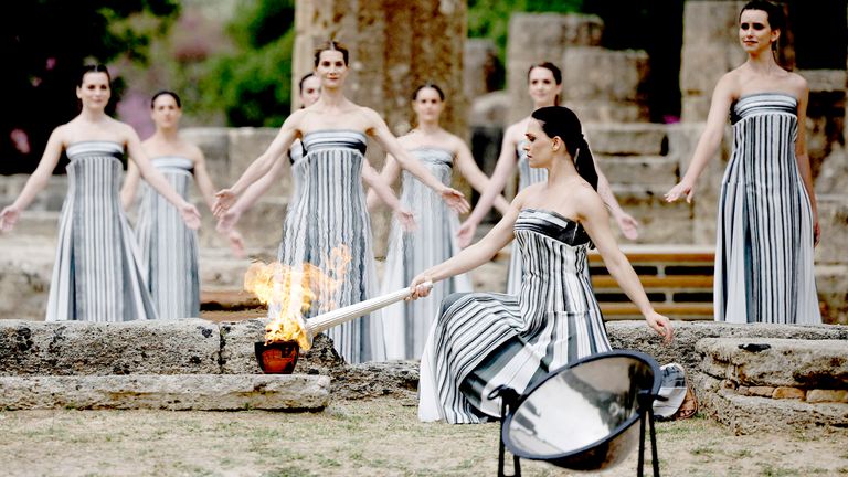 Greek actress Mary Mina, playing the role of High Priestess, lights the flame during the Olympic Flame.
Pic: Reuters