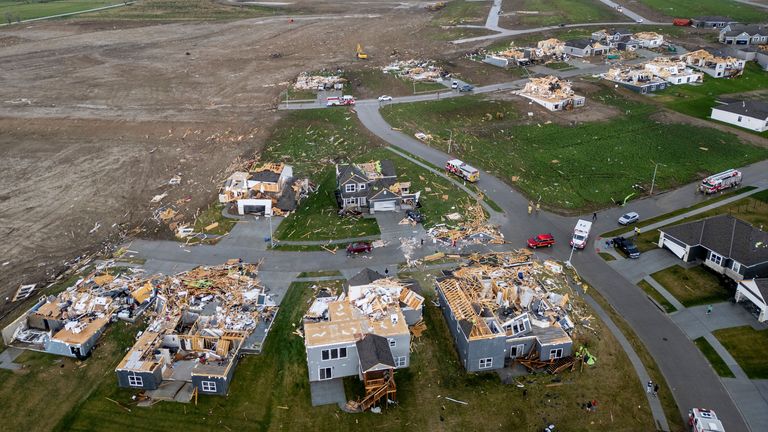 Damaged houses are seen after a tornado passed through the area near Omaha, Neb., on Friday, April 26, 2024. (Chris Machian/Omaha World-Herald via AP)