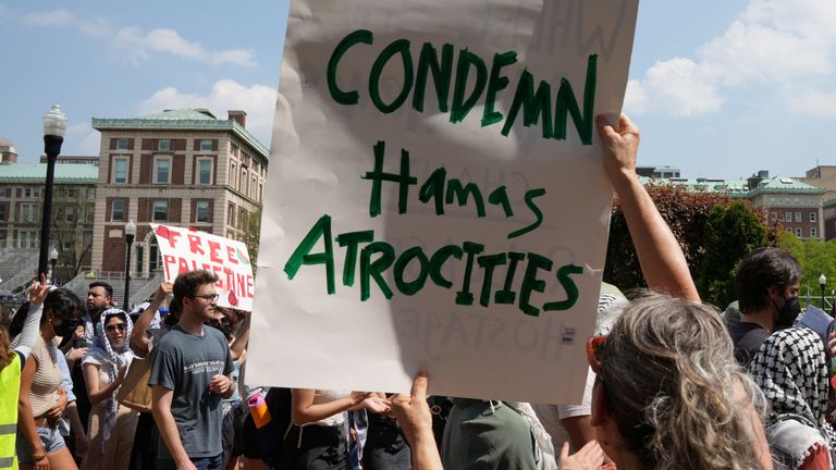 A counter-protester holds a sign during a march on the Columbia University campus in support of a protest encampment supporting the Palestinians, despite a 2 p.m. deadline set by university officials to disband or facing suspension, during the ongoing conflict between Israel and the Palestinian Islamist group Hamas, in New York, U.S., April 29, 2024. REUTERS/David Dee Delgado
