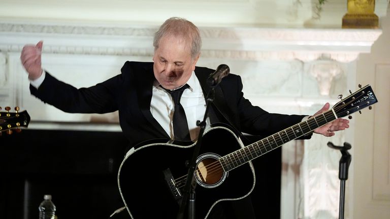 Singer and songwriter Paul Simon entertains in the State Dinging Room during a State Dinner with President Joe Biden and Japanese Prime Minister Fumio Kishida at the White House, Wednesday, April 10, 2024, in Washington. (AP Photo/Evan Vucci)