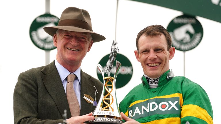 Paul Townend (right) and coach Willie Mullins holding the trophy