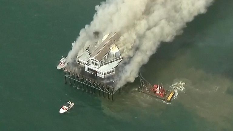 Fire rages at the end of the Oceanside Pier in California