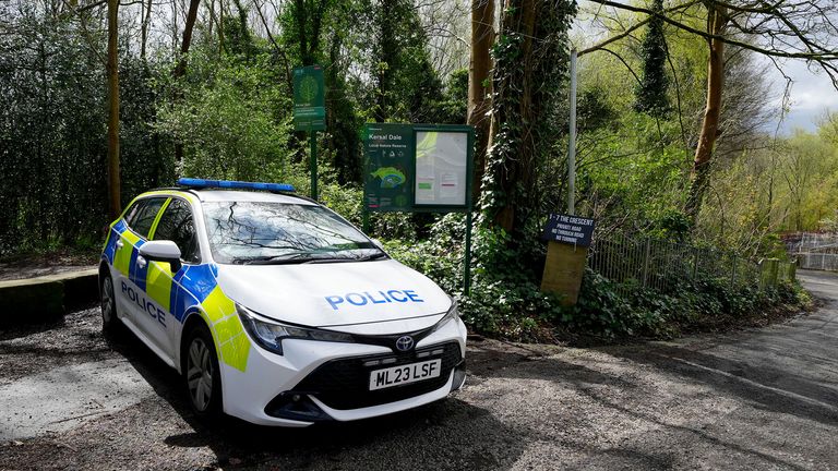 A police car parked at the entrance to Kersal Dale, near Salford.
Pic:PA