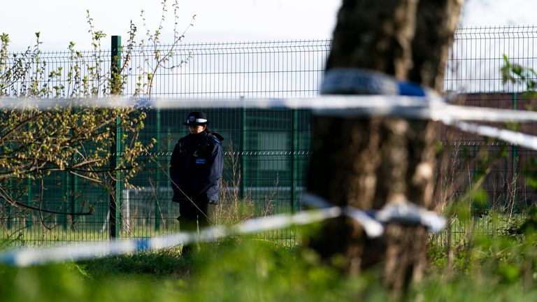 Police near the scene in Rowdown Fields, a park in Croydon, south London where human remains were found.
Pic: PA