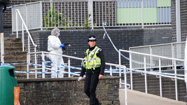 Police and forensic investigators at the scene of the attack in Ammanford, Carmarthenshire, in April 2024. Pic: PA