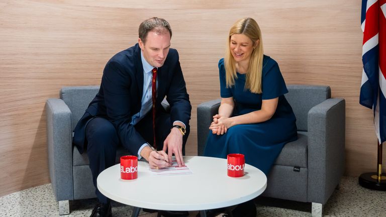 Dr Dan Poulter signing his Labour membership form with Labour's Ellie Reeves MP. Pic: Labour Party