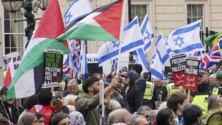 People take part in a pro-Palestine march as they walk past a counter protest on Waterloo Place in central London. Picture date: Saturday April 27, 2024.