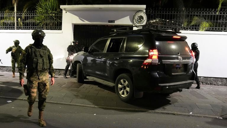 A vehicle was parked outside before Ecuadorian police forcibly entered the premises. Pic: AP 