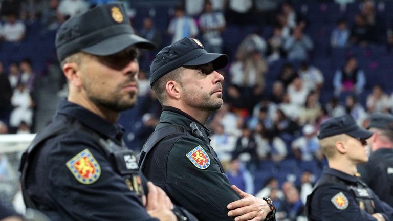 Police officers inside the Bernabeu during the match. Pic: Reuters