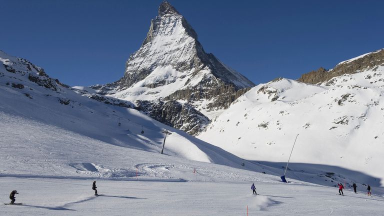 Skiers ride down the slopes at Riffelberg with Mount Matterhorn in the background. File pic: AP
