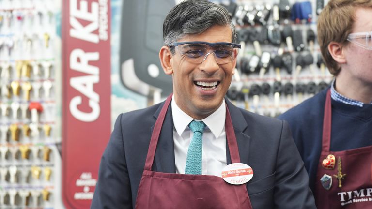 Rishi Sunak during a visit to a branch of Timpson,.
Pic: PA