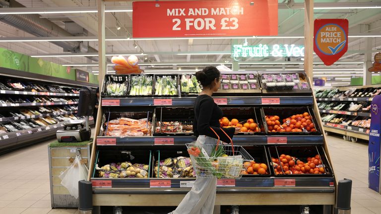 A customer shops in the fruit aisle inside a Sainsbury?s supermarket, in Richmond, West London, Britain February 21, 2024. REUTERS/Isabel Infantes