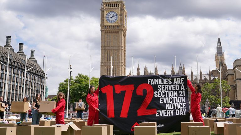 Activists from Shelter stage a protest in Parliament Square. Pic: PA