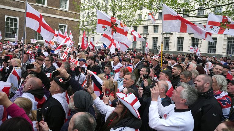 People wave flags during a St George&#39;s Day rally on Whitehall, in Westminster, central London. Picture date: Tuesday April 23, 2024.

