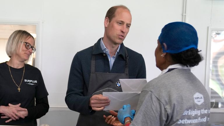 Volunteer Rachel Candappa presented a card to Prince William's wife during a visit to Surplus to Supper.Image: AP