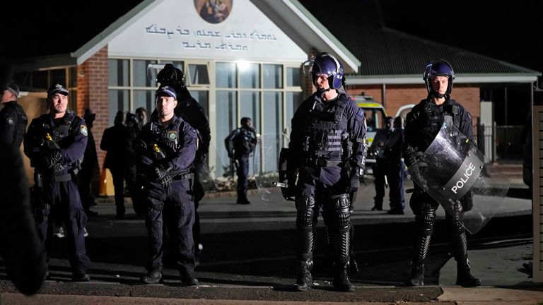 Pic: AP
Security officers stand guard outside Orthodox Assyrian church in Sydney, Australia, Monday, April 15, 2024. Police in Australia say a man has been arrested after a bishop and churchgoers were stabbed in the church. There are no life-threatening injuries. (AP Photo/Mark Baker)