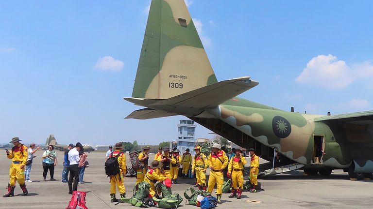 Members of a search and rescue team prepare to deploy on a Taiwan Air Force C-130 from southern Taiwan's Pingtung military air base. Pic: Taiwan Air Force Command/AP