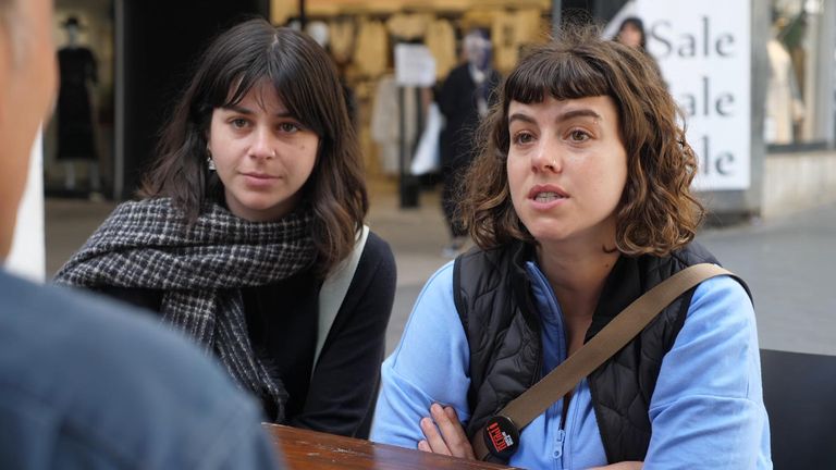 Students Talia (left) and Simona discuss the crisis