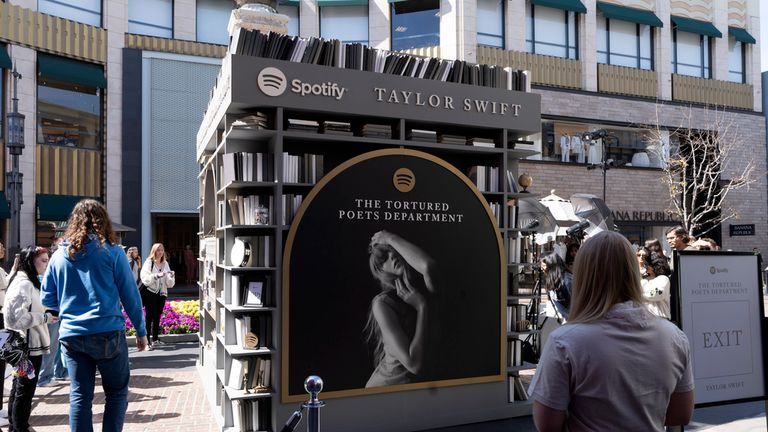 Taylor Swift fans check out a new pop-up opening to celebrate Taylor Swift&#39;s upcoming album "The Tortured Poets Department," at the Grove in Los Angeles on Wednesday, April 17, 2024. (AP Photo/Richard Vogel)