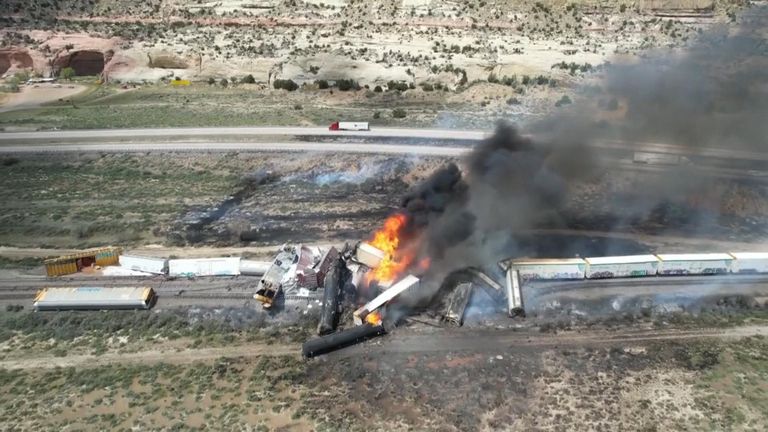 Freight train carrying fuel derails and catches fire in Arizona.