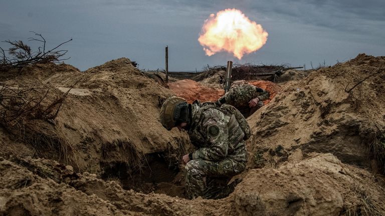 Ukrainian soldiers fire a mortar. Pic: Reuters