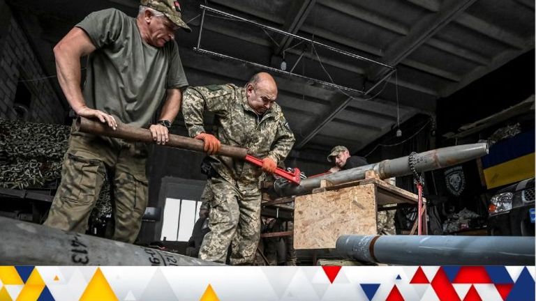 Members of the company tactical group "Steppe Wolves" of the Voluntary Formation of the Zaporizhzhia Territorial Community disassemble a shell for a BM-21 Grad multiple launch rocket system to convert it for use with a handmade small MLRS for firing toward Russian troops, amid Russia's attack on Ukraine, in Zaporizhzhia region, Ukraine April 26, 2024. REUTERS/Stringer