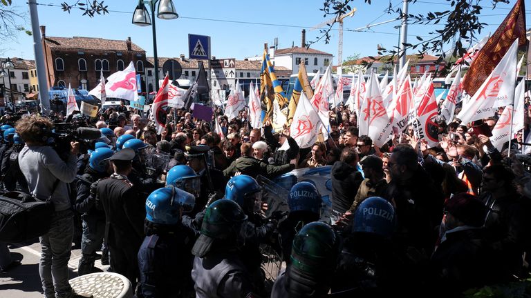 People clash with police as they protest against the introduction of the registration and tourist fee to visit the city of Venice.
Pic: Reuters